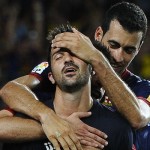 David Villa celebrates with team mates against Real Sociedad