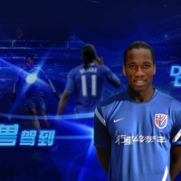 Drogba posing in his Shanghai jersey