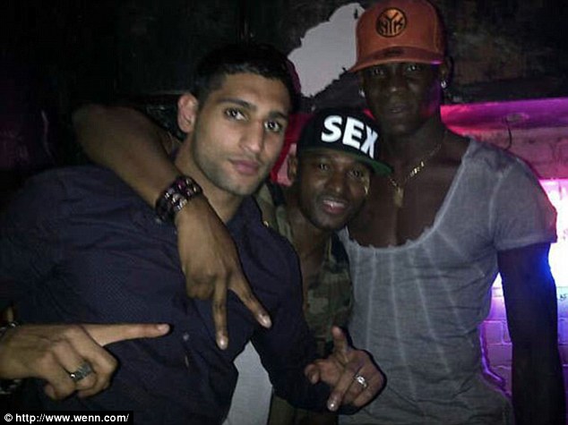 Partying-Balotelli (right) was pictured with Amir Khan at the Circle Club on Saturday