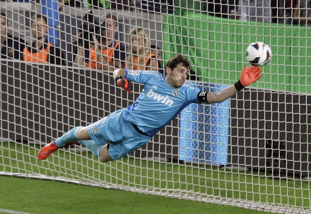 Real Madrid's Casillas fails to make a save as Barcelona's Messi scores his second goal during their Spanish first division soccer match at Nou Camp stadium in Barcelona