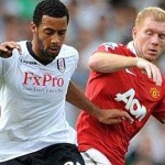 Moussa-Dembele-takes-on-Paul-Scholes