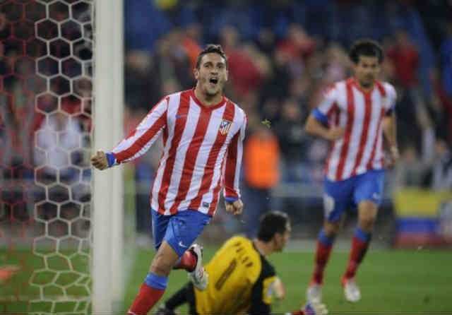 Atletico Madrid thrashed Sevilla 4-0 to draw level with Barcelona at the top of La Liga