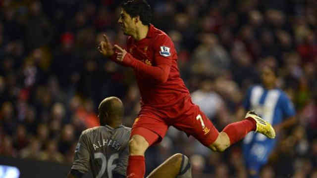 Luis Suarez celebrates his goal as he carries Liverpool to victory