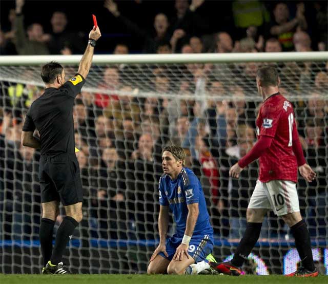 Torres is shown a red card in the fiercely contested Manchester United Chelsea clash