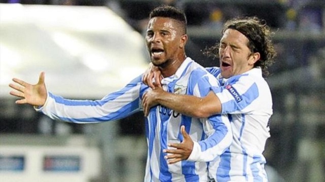 Malaga still finish top of Group C despite twice letting a goal lead slip against Anderlecht.