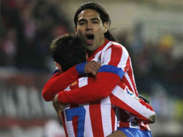 Adrian Lopez Alvarez celebrates his goal with Faclao