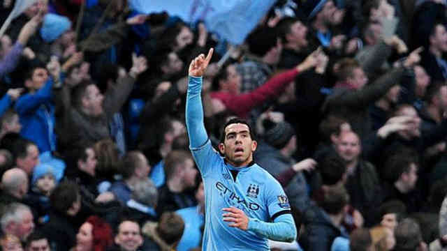Carlos Tevez celebrates his amazing free kick that looked like a rocket going to the net
