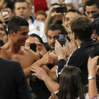 Cristiano Ronaldo celebrates with his fans by giving his Jersey to his fan