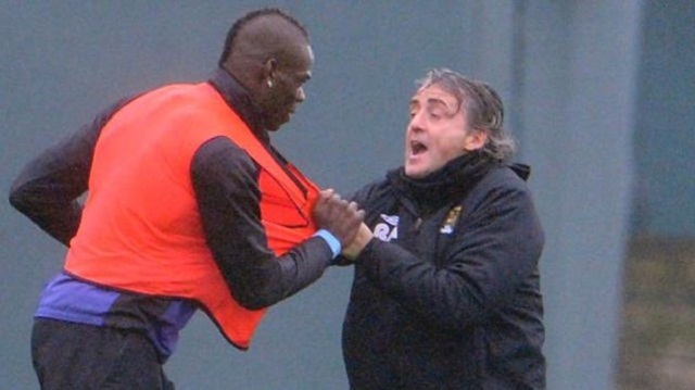 Mancini is seen to grab hold of Balotelli's orange bib in an apparent act of fury.