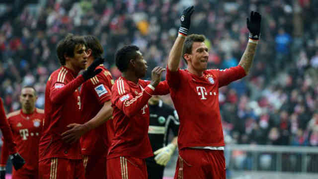 Mario Mandzukic celebrates his goal as Bayer Munich are rising up for the title