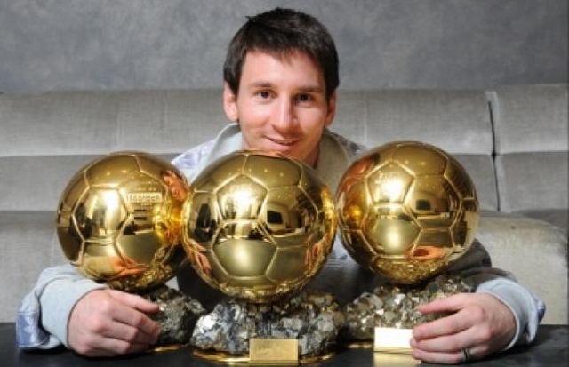 Messi shows off his three France Football Ballon d'Or. Will he get his fourth one tonight?