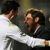 Gareth Bale celebrates with his manager with the final goal of the game