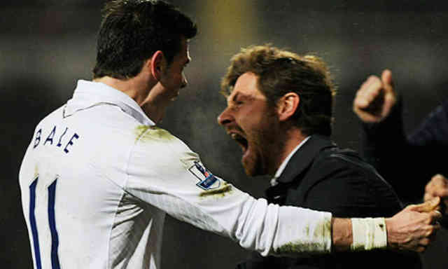 Gareth Bale celebrates with his manager with the final goal of the game
