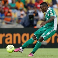 Nigeria's Emmanuel Emenike takes a free kick to score