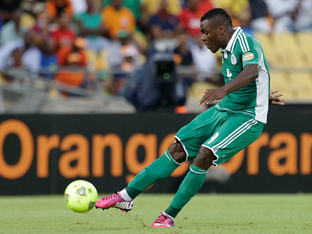 Nigeria's Emmanuel Emenike takes a free kick to score