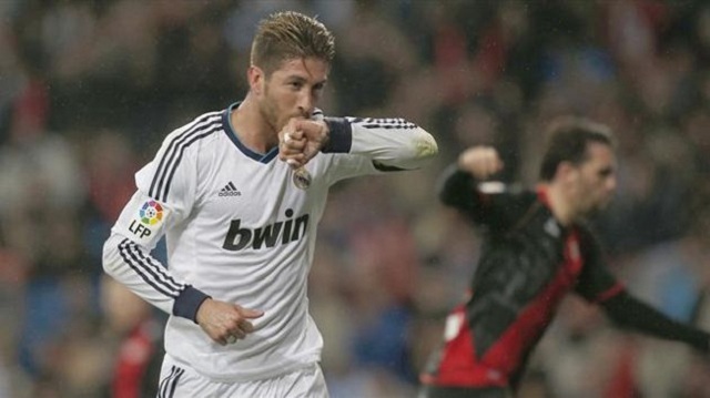  Real Madrid survived Sergio Ramos's early dismissal to beat city rivals Rayo Vallecano 2-0 at the Bernabeu