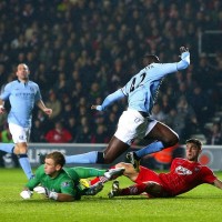 Manchester City 's Joe Hart and Yaya Toure can't stop Southampton scoring.