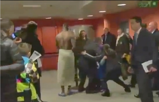 Italian striker Mario Balotelli strolls through the media mix zone