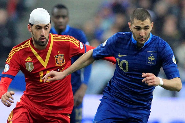 Karim Benzema here pictured with Busquets reckons that France did not deserve to lose against Spain