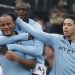 Kompany celebrates his goal with his team