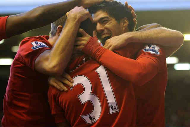 Luis Suraez carries on to try to beat RVP in the goal scoring game