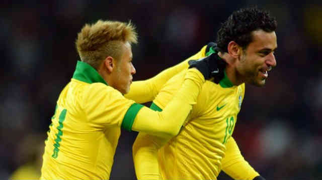 Neymar celebrates with Fred for his opener goal against Italy