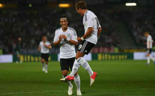 Ozil and Gotze celebrate for their win