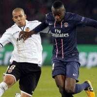 Paris Saint-Germain squeezed into the quarter-finals of the Champions League 3-2 on aggregate after drawing 1-1 at home to Valencia.