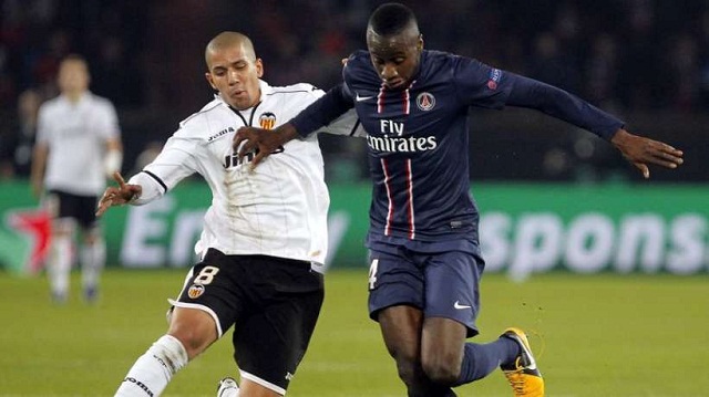 Paris Saint-Germain squeezed into the quarter-finals of the Champions League 3-2 on aggregate after drawing 1-1 at home to Valencia.