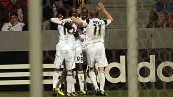 Webo celeberates with his team mates in the Europa League play off