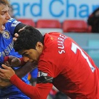 Luis Suarez bites Liverpool striker Branislav Ivanovic during the Liverpool-Chelsea clash