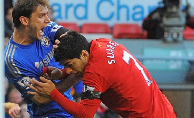 Luis Suarez bites Liverpool striker Branislav Ivanovic during the Liverpool-Chelsea clash