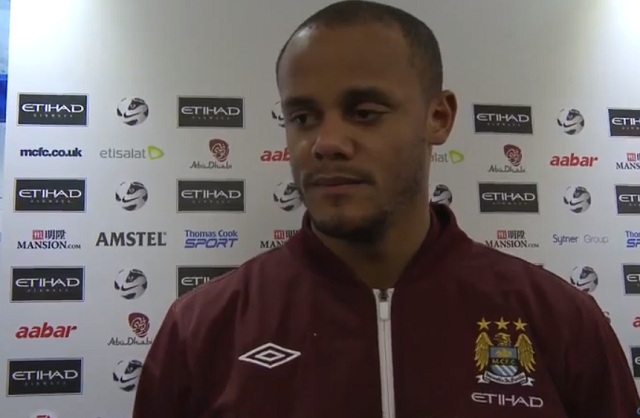 Vincent Kompany, pictured here answering questions of a journalist of Man City TV after a game had a feud with his coach Roberto Mancini and could be on his way to Bayern Munich