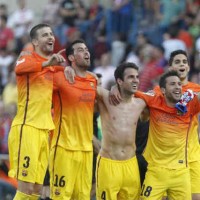 FC Barcelona players celebrate their victory against Atletico Madrid