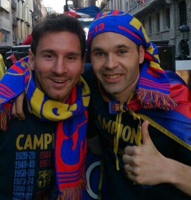 Messi and Iniesta celebrating the title-Lionel Messi will be injured for 2-3 weeks says FC Barcelona official website
