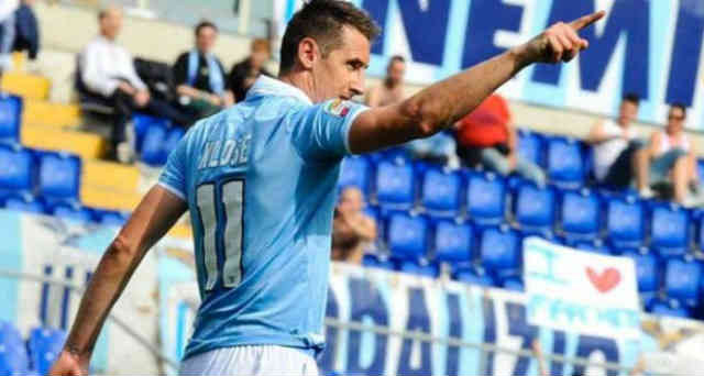 Miroslav Klose looks up as he celebrates his five goals