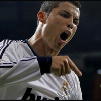 Real Madrid's Cristiano Ronaldo celebrates after scoring during a Spanish La Liga football match against Malaga's at the Santiago Bernabeu