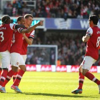 Theo Walcott celebrates with his team for his goal