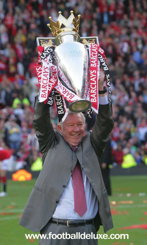 Sir Alex Ferguson winning won of the many trophies