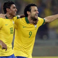 Fred and Paulinho celebrate their goals as Brazil off to the finals