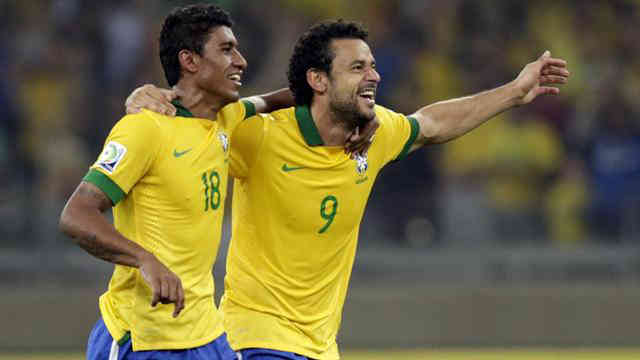 Fred and Paulinho celebrate their goals as Brazil off to the finals