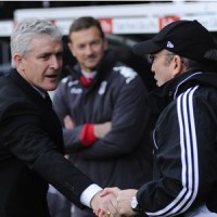 New Stoke City boss Mark Hughes, shares a handshake with old boss  Tony Pullis in diferent times