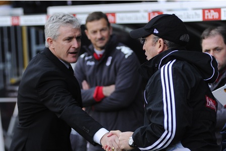 New Stoke City boss Mark Hughes, shares a handshake with old boss  Tony Pullis in diferent times