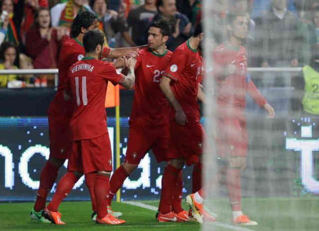 Postiga comes to the rescue for Portugal