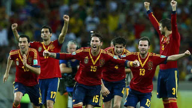 Spain celebrate their goal as they beat Italy in the semi-finals of the Confederation Cup