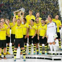 Borussia Dortmund carry the trophy of the German Super Cup