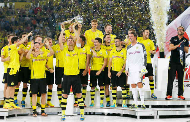 Borussia Dortmund carry the trophy of the German Super Cup