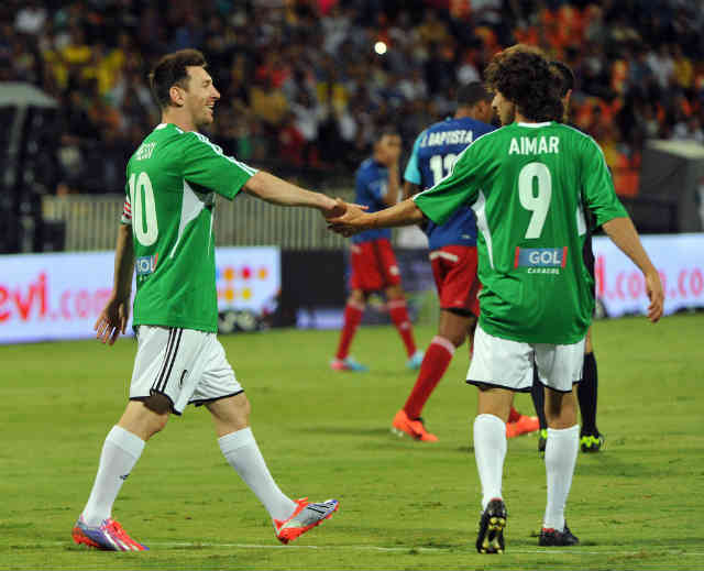 Lionel Messi celebrates with Aimar