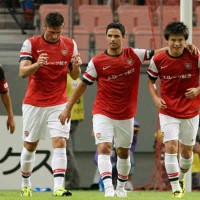 Miyaichi celebrates his goal with his team mates in Japan