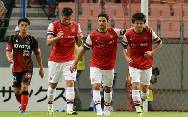 Miyaichi celebrates his goal with his team mates in Japan